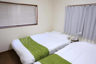 a bedroom with two white beds and a window at wonderful stay TOKYO Daitabashi - Vacation STAY 31675v in Tokyo