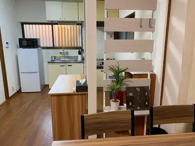 a kitchen with a table and chairs in a room at wonderful stay TOKYO Daitabashi - Vacation STAY 31675v in Tokyo