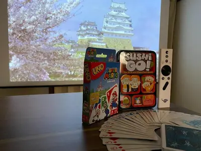 a table with two boxes of sushi go and a video game at wonderful stay TOKYO Daitabashi - Vacation STAY 31675v in Tokyo