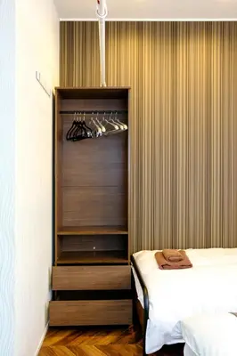 a room with a bed and a closet at Serendipity Kinshicho - 7 mins to JR Station - Near Skytree & Foodie hub in Tokyo