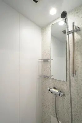a bathroom with a shower with a mirror at Serendipity Kinshicho - 7 mins to JR Station - Near Skytree & Foodie hub in Tokyo