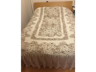 a bed with a lace bedspread on top of it at K&M Heights - Vacation STAY 32224v in Tokyo