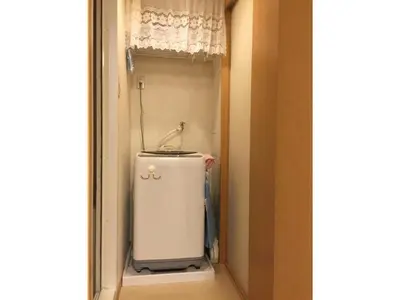 a small refrigerator in a hallway with a window at K&M Heights - Vacation STAY 32224v in Tokyo