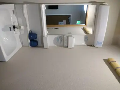 a kitchen with a white refrigerator and a mirror at Hitoyado Ryokan Higashiueno - Vacation STAY 35819v in Tokyo