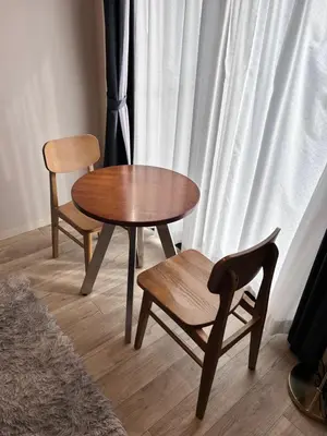 a table and two chairs and a table and a chair at THREE in Tokyo