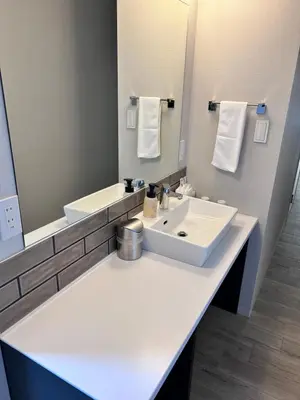 a bathroom with a white sink and a mirror at THREE in Tokyo