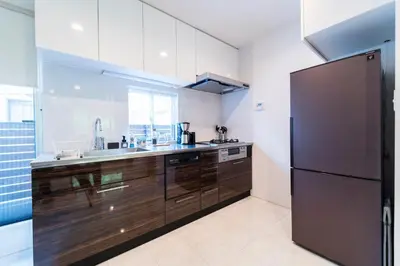 a large kitchen with a refrigerator and a sink at Shibuya-ku - House - Vacation STAY 11243 in Tokyo