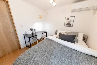 a bedroom with a bed and a desk at Sky Tree house in Tokyo