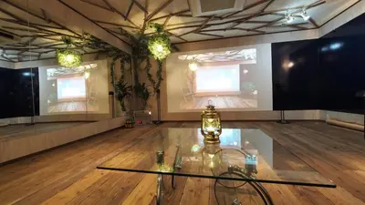 a room with a glass table on a wooden floor at Grand Piano & Shinjuku 5min walk from station in Tokyo