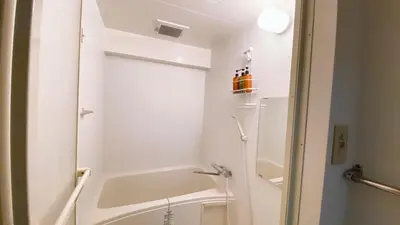 a white bathroom with a tub and a sink at Esperanza 204\u53f7\u5ba4 in Tokyo