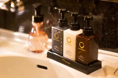 a bathroom sink with two bottles ofodorizers on it at Tosei Hotel Cocone Asakusa in Tokyo