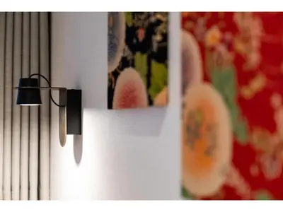 a light hanging on a wall with pictures on it at Hotel Emit Shibuya - Vacation STAY 40886v in Tokyo
