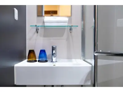 a bathroom with a sink with two vases on it at Hotel Emit Shibuya - Vacation STAY 40886v in Tokyo