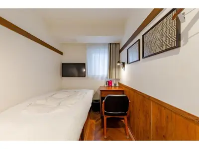 a bedroom with a bed and a desk and a chair at Hotel Emit Shibuya - Vacation STAY 40890v in Tokyo