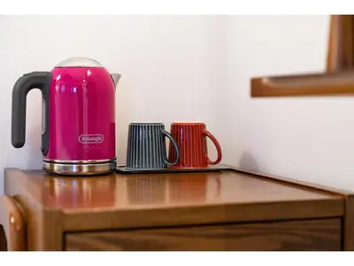 a pink appliance sitting on top of a wooden table at Hotel Emit Shibuya - Vacation STAY 40894v in Tokyo