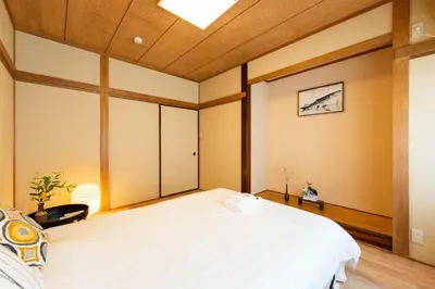 a bedroom with a large bed and a skylight at \u5bc5\u30db\u30c6\u30eb \u53f0\u6771 Hotel \u5bc5 \u53f0\u4e1c Tora Hotel Taito D in Tokyo