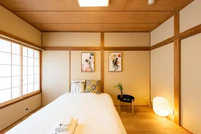 a bedroom with a large bed and a window at \u5bc5\u30db\u30c6\u30eb \u53f0\u6771 Hotel \u5bc5 \u53f0\u4e1c Tora Hotel Taito D in Tokyo