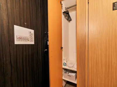 an orange door with a sign on it in a room at Rakuten STAY Tokyo Asakusa Okaimono Panda Double Room in Tokyo