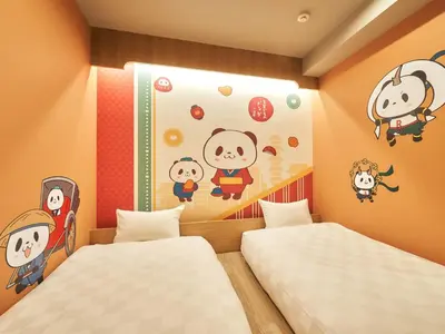 two beds in a room with hello kitty stickers on the wall at Rakuten STAY Tokyo Asakusa Okaimono Panda Twin Room B in Tokyo