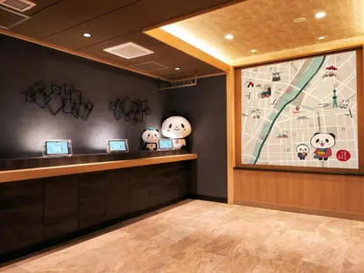 a lobby with a counter with hello kitty paintings on the wall at Rakuten STAY Tokyo Asakusa 1 Double Bed Room in Tokyo