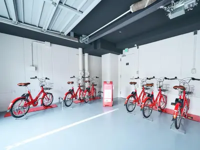 a row of red bikes parked in a room at Rakuten STAY Tokyo Asakusa 1 Double Bed Room in Tokyo