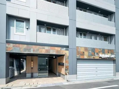 a building with a parking garage in front of it at Rakuten STAY Tokyo Asakusa 1 Double Bed Room in Tokyo