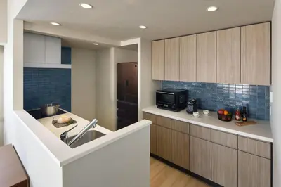 a kitchen with a sink and a microwave at Oakwood Hotel & Apartments Azabu Tokyo in Tokyo