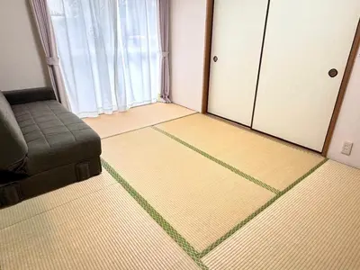 a living room with a couch and a window at La Mer Urayasu - Vacation STAY 11148 in Urayasu