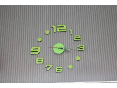 a clock with green numbers on a wall at Maison Cresta Urayasu - Vacation STAY 11150 in Urayasu