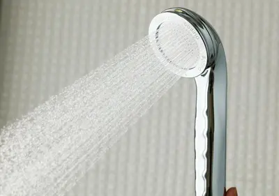 a shower head with water coming out of it at APA Hotel Asakusa Kaminarimon Minami in Tokyo
