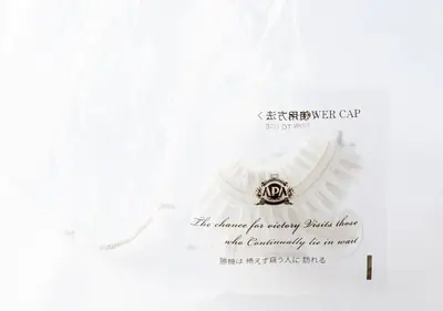 a white envelope with a certificate with a ring at APA Hotel Asakusa Kaminarimon Minami in Tokyo