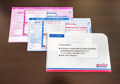 a stack of visa tickets on a table at APA Hotel Asakusa Kaminarimon Minami in Tokyo