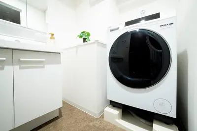 a white washing machine in a white kitchen at BON Tokyo Asakusa in Tokyo