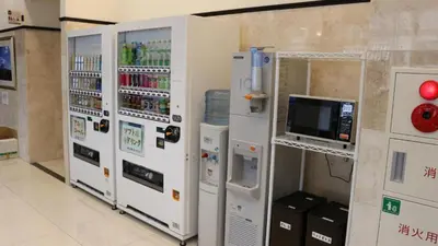 a row of vending machines in a store at Toyoko Inn Tokyo Shinagawa Aomono-yokocho-eki in Tokyo