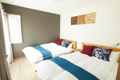 two beds sitting next to each other in a bedroom at SG Premium KASAI - Vacation STAY 44353v in Tokyo