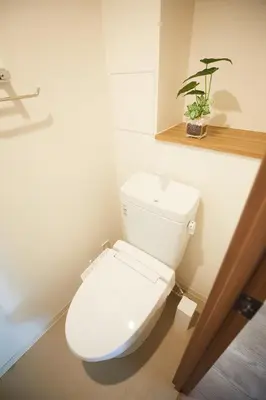 a white toilet in a bathroom with a plant on a shelf at SG Premium KASAI - Vacation STAY 44353v in Tokyo