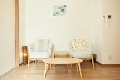 a living room with two chairs and a coffee table at SG Premium KASAI - Vacation STAY 44353v in Tokyo