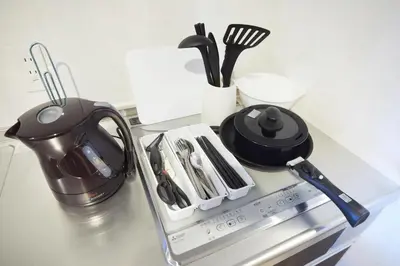a kitchen counter with a tea pot and utensils at SG Premium KASAI - Vacation STAY 44266v in Tokyo