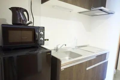 a kitchen with a microwave and a sink at SG Premium KASAI - Vacation STAY 44266v in Tokyo