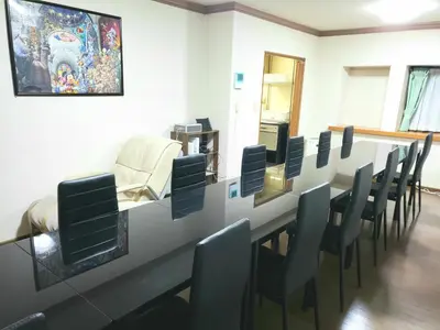 a waiting room with a long table and chairs at Within walking distance of Disneyland! - Vacation STAY 11473 in Urayasu
