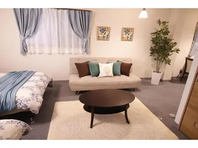 a living room with a couch and a table at Central Field - Vacation STAY 29651v in Tokyo