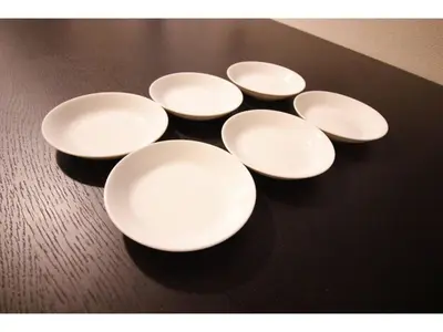 a group of white plates sitting on a table at Central Field - Vacation STAY 29651v in Tokyo