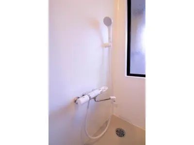 a shower with a hose attached to a wall at Central Field - Vacation STAY 29627v in Tokyo