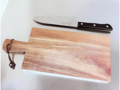 a cutting board and a knife on a table at Central Field - Vacation STAY 29627v in Tokyo