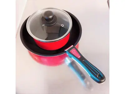 a red and black pot sitting on top of a spatula at Central Field - Vacation STAY 29627v in Tokyo