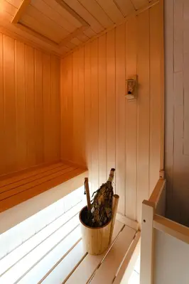 a wooden sauna with a bottle of wine in it at hotel hisoca ikebukuro in Tokyo