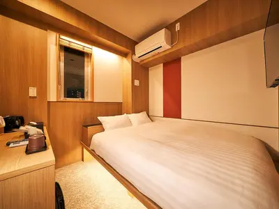 a small bedroom with a bed and a window at Rakuten STAY Tokyo Asakusa Single Room in Tokyo