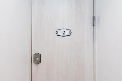 a door with a sign on it with the number seven on it at Villa Roppongi in Tokyo