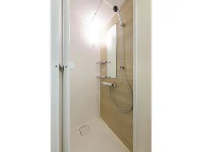 a bathroom with a shower with a mirror at rakuna Inn Dou-sasazuka - Vacation STAY 47231v in Tokyo