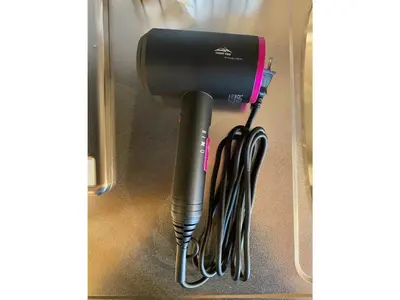 a hair dryer is hanging on a wall at THE BONDS HOTEL TOKYO - Vacation STAY 48446v in Tokyo